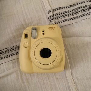 Yellow Fujifilm instax mini 8 camera